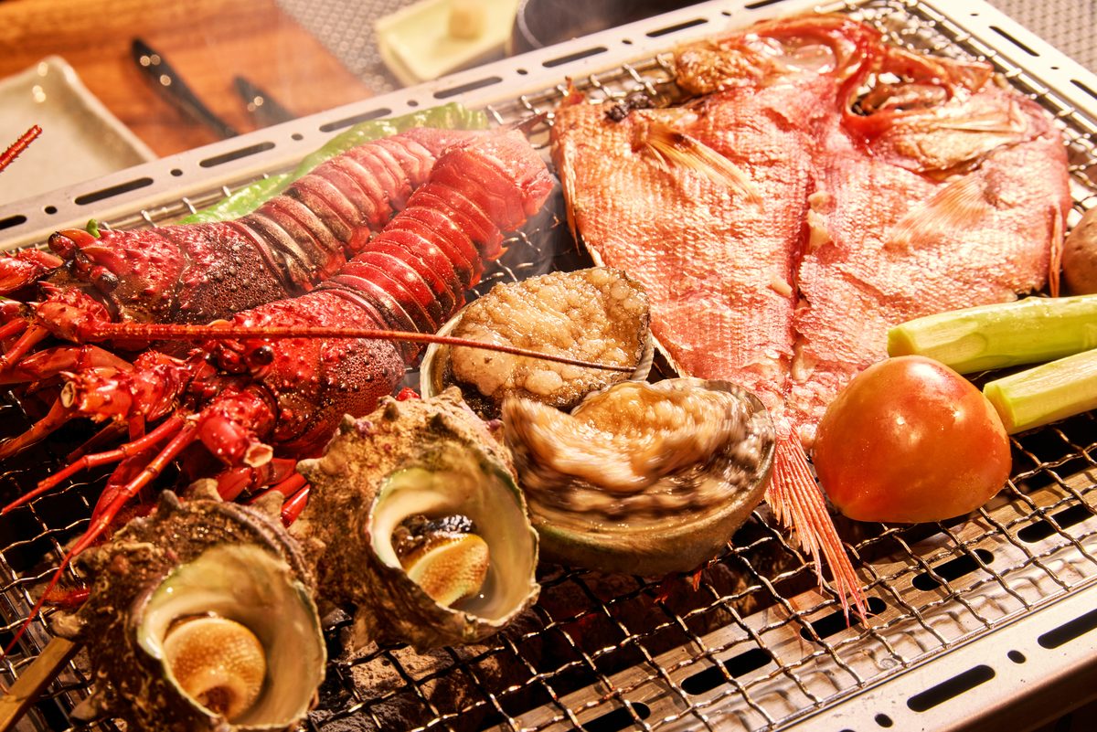 Spiny lobster, alfonsino and abalone over charcoal
