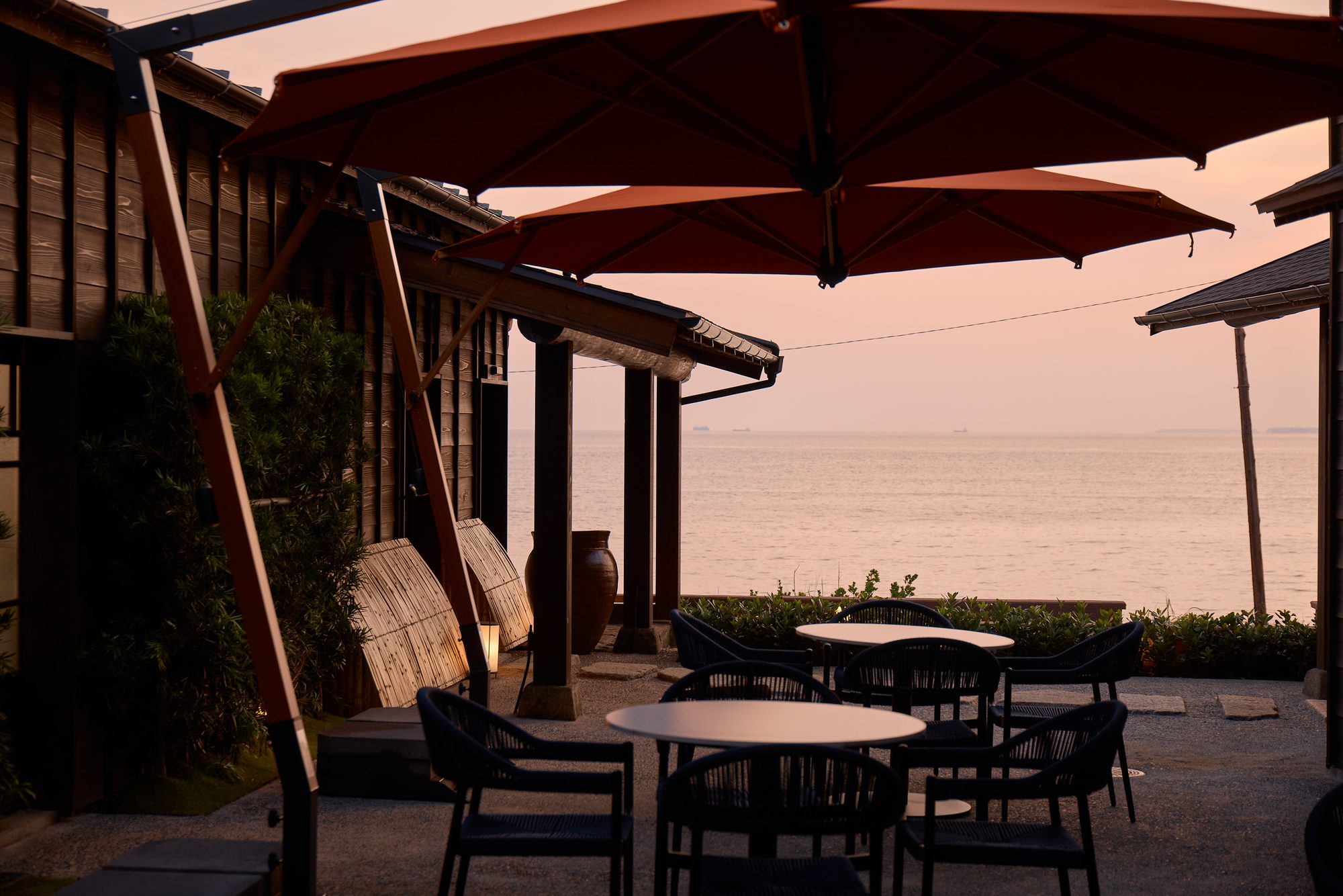 A seaside terrace at dusk