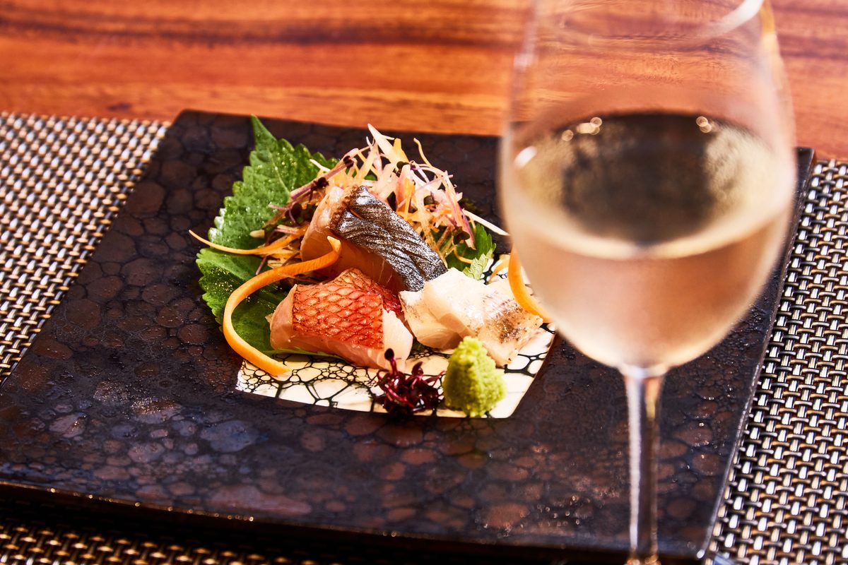 A seasonal dish served with sake vessels