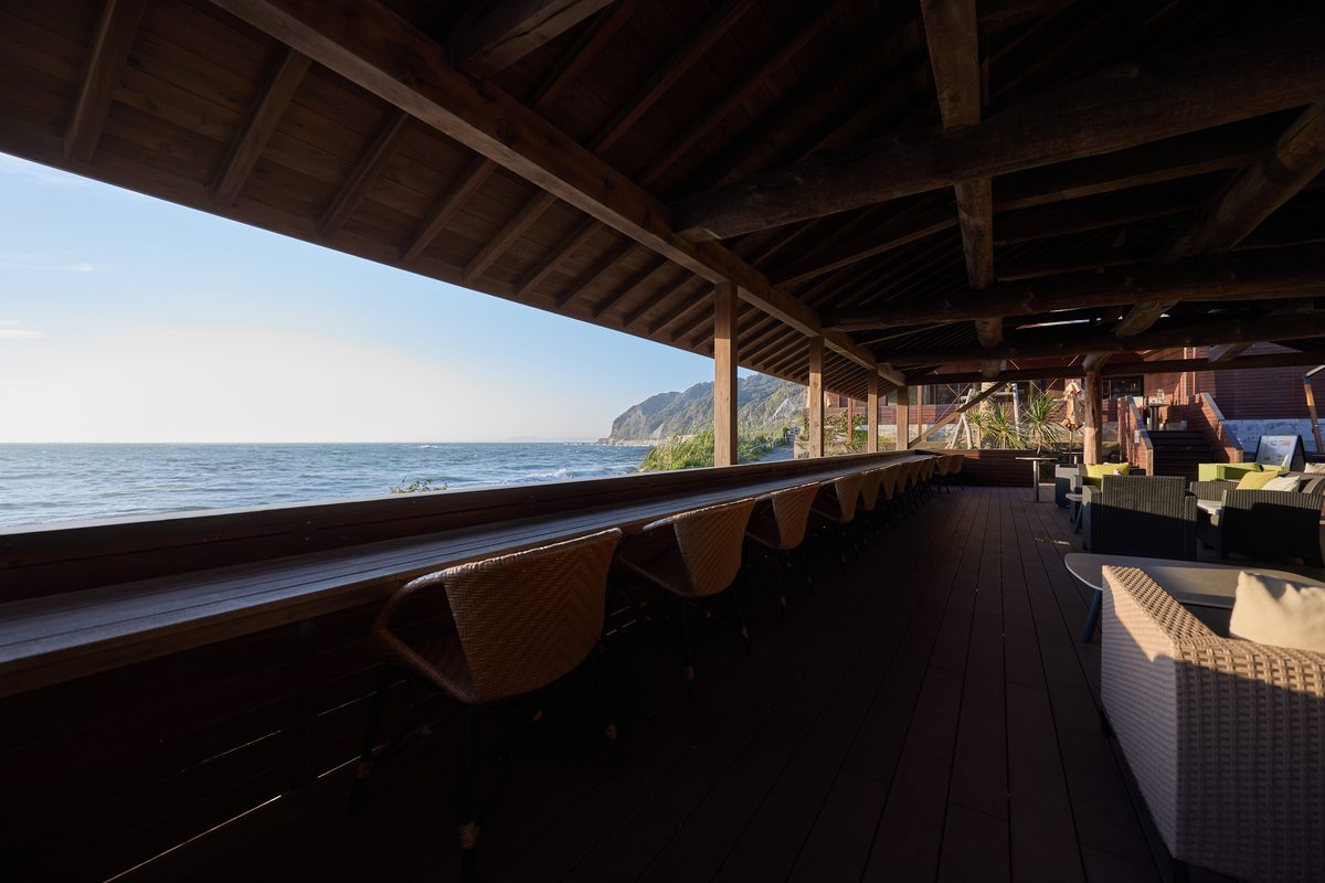 A wooden deck counter facing the sea
